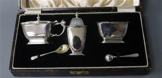 A cased 1930s Art Deco silver three piece condiment set, William Neale Ltd, Birmingham, 1937.